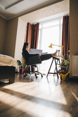 woman working at home. telework on laptop