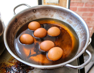 Eggs are boiled in a pan in the kitchen