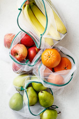 Fresh fruits, apples, bananas, pears and blood oranges. Zero waste Top view