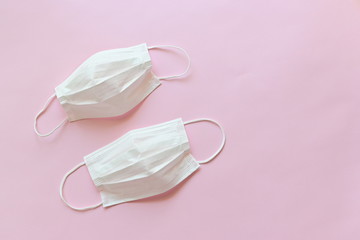 medical hygiene face mask on pink background