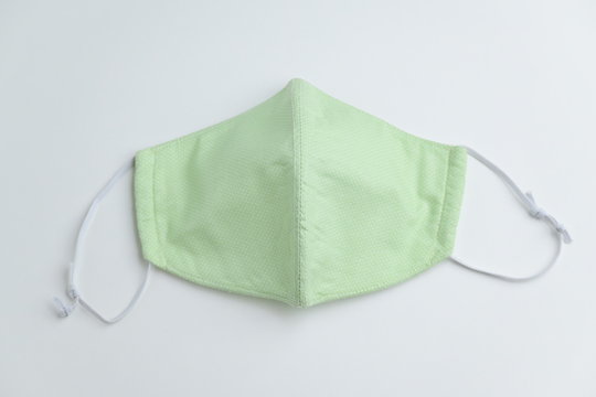 design of face mask handmade sewing from fashion fabric cotton cloth on white background