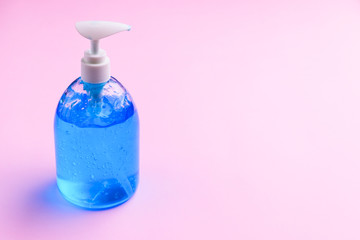 clean alcohol gel bottle sanitizer medical on pink background