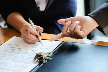 Real estate agent offer hand for customer sign agreement contract signature for buy or sell house....