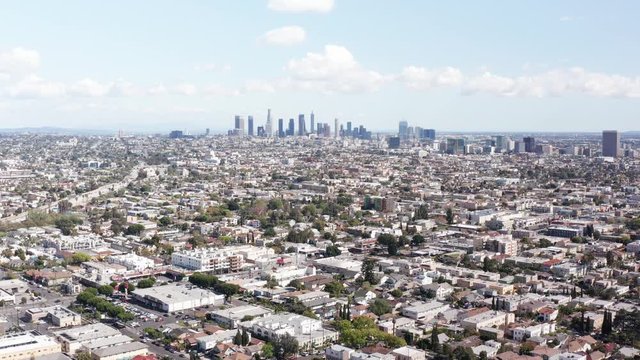 Wide aerial shot of sprawling Los Angeles at fast speed. 4K