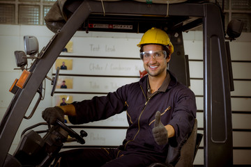 Portrait Industrial worker wearing safety uniform and safe helmet for work and control machines  with industry factory background.