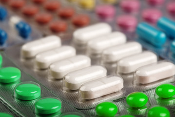 Pills tablets and capsules in blisters for flu treatment. Health care.