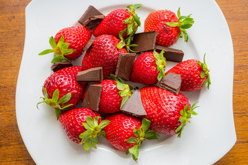 strawberry and chocolate on a white plate