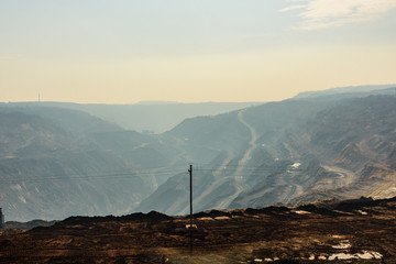 View on iron ore quarry in a dust haze