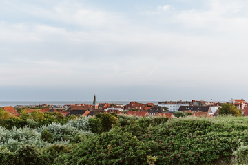 View from the dunes towards the main village on the north sea island Juist, East Frisia, Germany, Europe, in evening light.