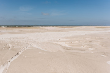 Wide sand beach landscape, sunny day, blue sky, Amrum, Germany