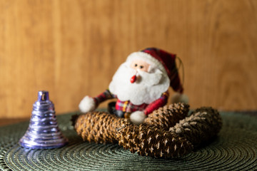 Santa Claus amid pine cones and Christmas motifs