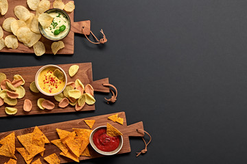 Potato, Nachos corn chips with salsa, sour cream, cheese dip sauce. Spinach, tomato snack chip on...