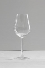 Empty wine glasses in white grey shades