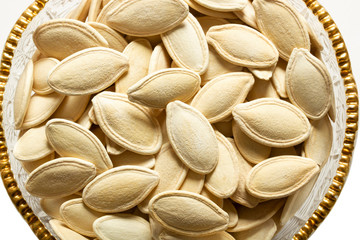 fresh pumpkin seeds in glass dish