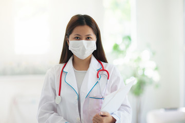 Fototapeta na wymiar Doctor or nurse with stethoscope and face mask.