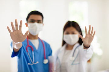 Doctor or nurse with stethoscope and face mask.