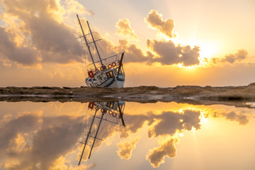 Sailing boat wreck at sunset