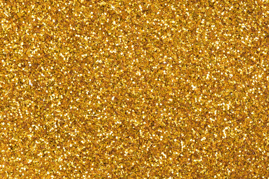 Glitter background in new stylish tone, your texture in gold tone as part of your holiday desktop.