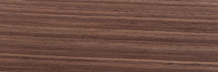 Unusual brown nut veneer background for your style. Natural wood texture, pattern of a long veneer sheet, plank.