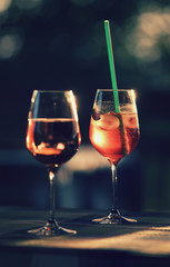 Two glasses with wine and cocktail outdoor