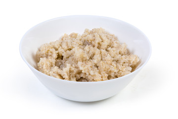 Barley porridge in bowl on a white background