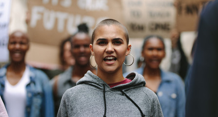 Woman protesting with a group of people