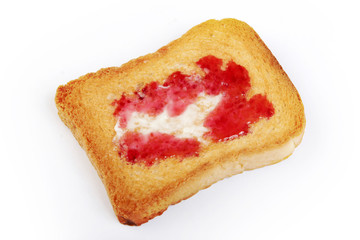 butter and jam on toasted bread