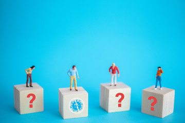Miniature figure of a man who clean from infection of pandemic corona virus or covid-19 on blue...