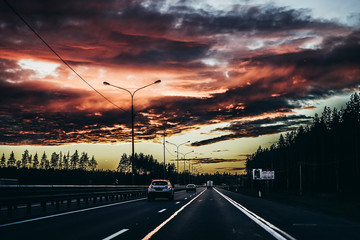 beautiful sunset and road in the evening red sky with clouds