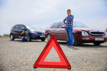Man calling and car crash