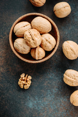 Top view on a heap of walnuts on a table.