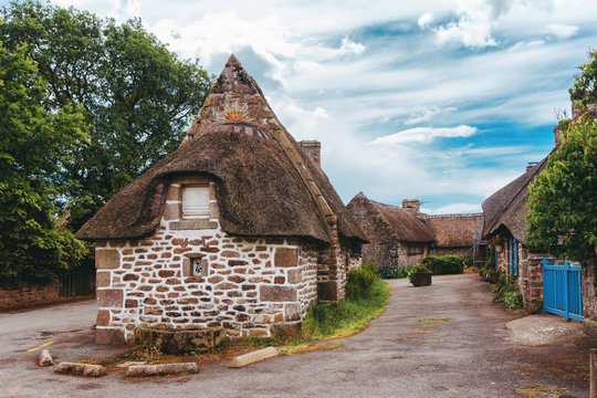 Village of Kerascoet, traditional stone houses with thatched roof in Brittany France.A beautiful stone fabulous thatched-roof house in the Brittany region of France. Interesting European architecture