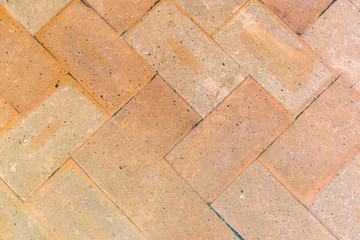 Vintage floor tiles in yellow and orange. As a background or for design.