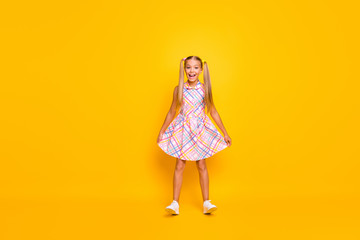 Full length photo of beautiful small lady good mood pretty long tails hold skirt stand on heels...