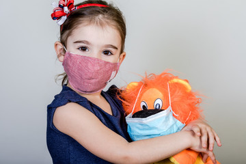 Little girl has fabric mask protect herself from Coronavirus COVID-19