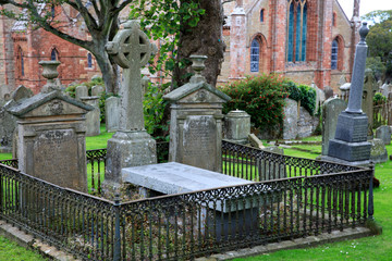 Fototapeta premium Kirkwall - Orkney (Scotland), UK - August 06, 2018: The cemetery at Saint Magnus cathedral in Kirkwall, Orkney, Scotland, Highlands, United Kingdom