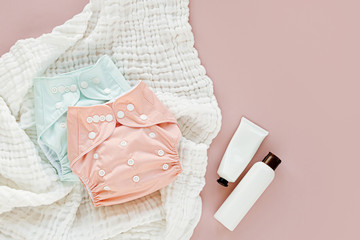 Baby set of cloth diaper with insert laying  and muslin swaddle blanket.  Set of newborn...