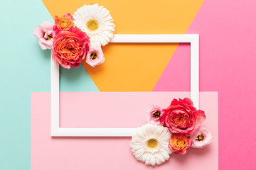 Obraz na płótnie Canvas Happy Mother's Day, Women's Day, Valentine's Day or Birthday Pastel Colored Background. Multicolored flat lay mock up greeting card with beautiful flowers.