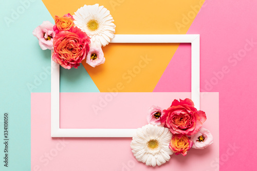 Happy Mother's Day, Women's Day, Valentine's Day or Birthday Pastel Colored Background.  Multicolored flat lay mock up greeting card with beautiful flowers.