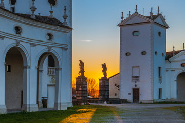 Naklejka premium Sunset between the columns. Ancient residence of the Doge of Venice. Udine. Italy