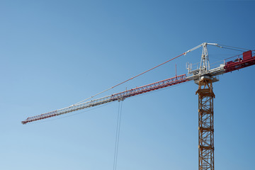 Working crane on a blue sky background