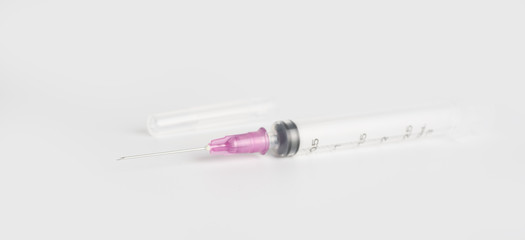 New syringe on white background