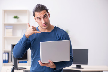 Young male it specialist working in the office