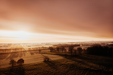 Obraz premium sunset over field with copyspace