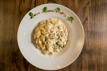 Gnocchi with turkey meat and porcini mushrooms in a cream sauce