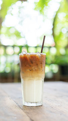 Iced latte coffee on a wooden table.