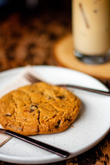Chocolate cookies on wooden table. Chocolate chip cookies shot