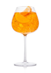 Spritz summer cocktail with ice and orange slice in wine glass on white.