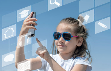 School child holding a mobile smartphone. Kid studying online. Touch screen interface. Digital learning concept. Distance e-learning. Internet technology. Remote online education. Home schooling