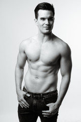 Fototapeta premium Young handsome man shirtless in black and white